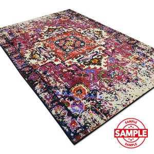 May include: A colorful rug with a vintage, distressed look. The rug features a central medallion with intricate floral and geometric patterns in shades of red, pink, blue, and green. The background is a cream color with a faded, worn appearance.