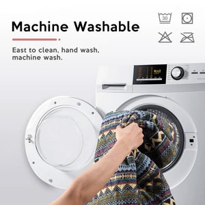 May include: A white washing machine with a patterned blanket being placed inside. The washing machine has a digital display and a control knob. The text "Machine Washable" is displayed above the washing machine. The text "East to clean, hand wash, machine wash." is displayed below the washing machine.