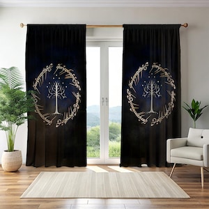 May include: Dark blue and black curtains with a gold tree design inside a circular frame. The curtains are hanging in front of a window. The room also features a rug, a chair, and a potted plant.