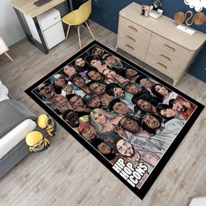 May include: Black and white rug with a collage of hip hop icons. The rug features a variety of famous rappers and singers, including 2Pac, Biggie, and Jay-Z. The rug is rectangular and has a black background with white outlines. The text "Hip Hop Icons" is printed in white at the bottom of the rug.