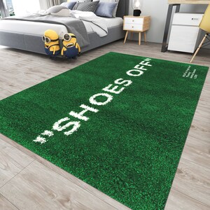 May include: Green doormat with the text "Shoes Off" in white lettering.