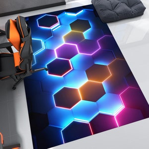 May include: Abstract geometric rug with a honeycomb pattern in shades of blue, purple, and orange. The rug has a modern and contemporary design.