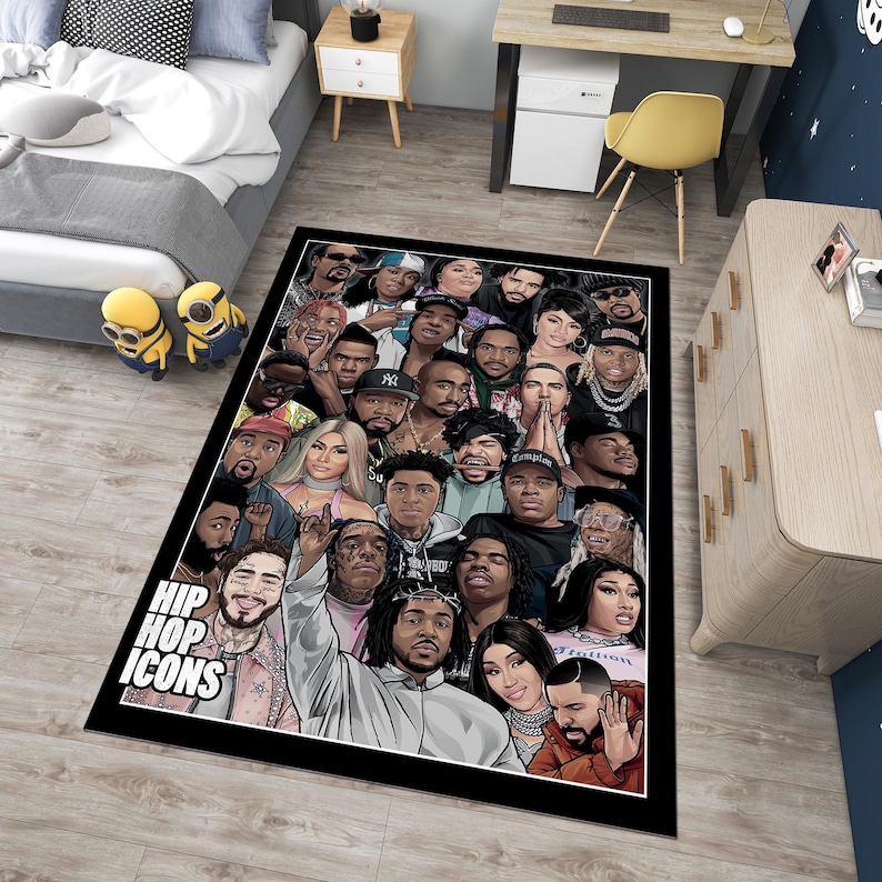 May include: A black and white rug with a collage of hip hop icons. The rug features a variety of artists, including rappers, singers, and producers. The rug is rectangular and has a black border. The text "Hip Hop Icons" is printed in white letters on the rug.