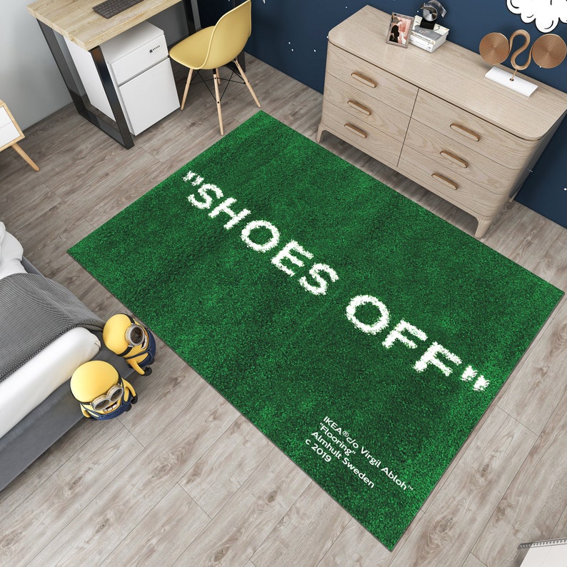 May include: Green shag rug with the text "SHOES OFF" in white. The rug also has the text "IKEA c/o Virgil Abloh&trade; Flooring Almhult Sweden c 2019" in white.