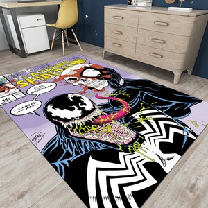 May include: A purple and white comic book rug featuring a black and white illustration of Venom and Spider-Man. The text on the rug reads "Amazing Spider-Man" and "I killed him well!"