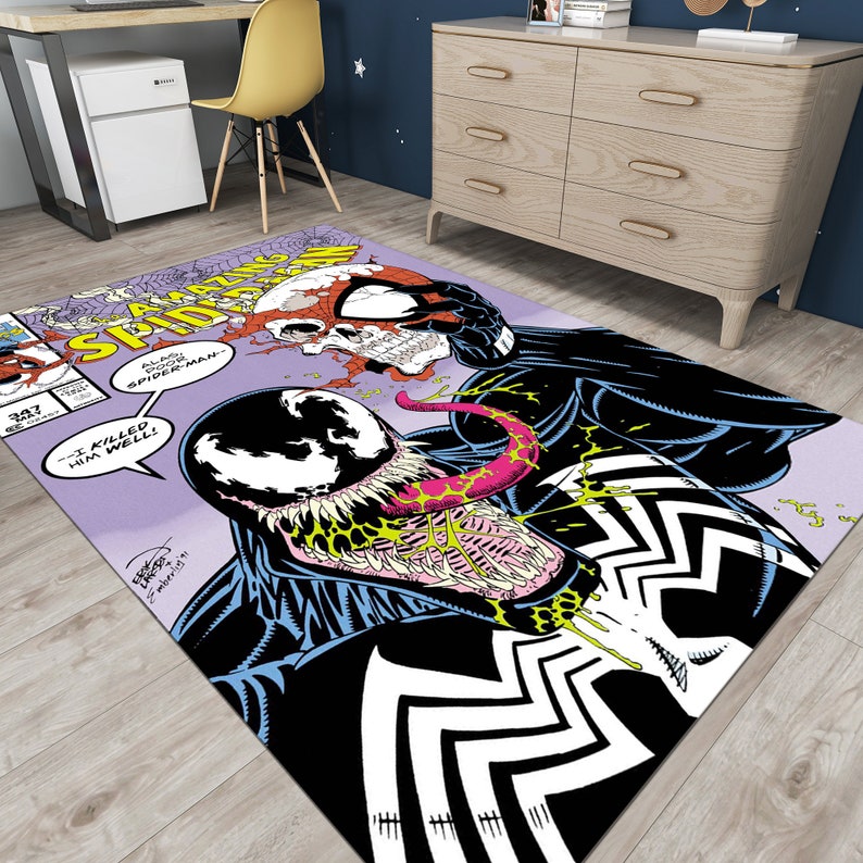 May include: A purple and white comic book rug featuring a black and white illustration of Venom and Spider-Man. The text on the rug reads "Amazing Spider-Man" and "I killed him well!"