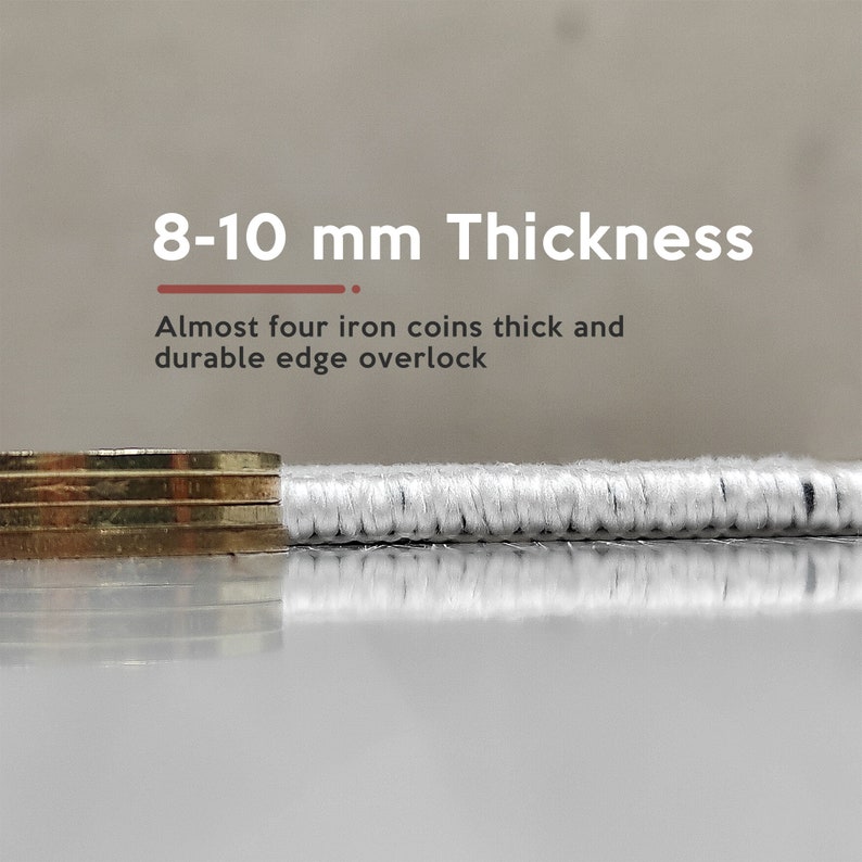 May include: Close-up of a white fabric with a thick, durable edge. The fabric is 8-10 mm thick, almost the thickness of four iron coins.