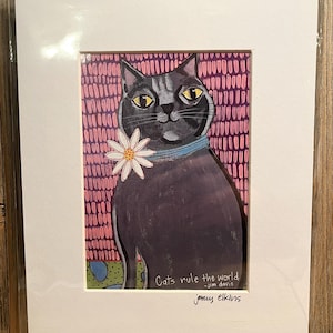 May include: A black cat with a white flower behind its ear sits on a pink and purple patterned background. The cat has a blue collar and yellow eyes. The text "Cats rule the world - Jim Davis" is below the cat. The artist's name "jenny elkins" is below the text.