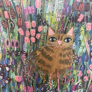 May include: A painting of a brown tabby cat sitting in a field of colorful flowers. The cat has green eyes and a pink nose. The flowers are pink, purple, and blue.
