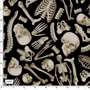 May include: Black fabric with a repeating pattern of beige human skeletal bones, including skulls, ribs, and limbs. The fabric has a medical or Halloween theme. The text "MR. BONE" is at the bottom.
