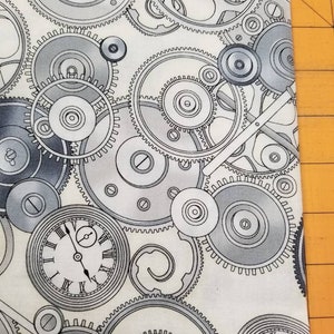 May include: A white fabric with a repeating pattern of gray and black clock gears. The gears are intricately detailed and appear to be moving.