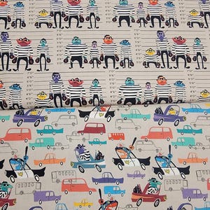 May include: A fabric print featuring two distinct sections. The top section displays cartoon characters in striped shirts against a height chart with imperial measurements. The bottom section shows a pattern of colorful cars and police vehicles.