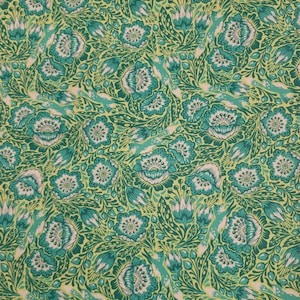 May include: A green and white floral pattern fabric with a repeating design of stylized flowers and leaves.