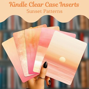 May include: A set of rectangular Kindle clear case inserts featuring various sunset patterns in shades of orange, pink, and cream. The text "Kindle Clear Case Inserts" and "Sunset Patterns" is printed in orange at the top of the image.