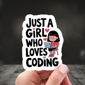 May include: A white sticker with black text that reads "Just a girl who loves coding". A cartoon illustration of a girl with glasses sitting on a chair and using a laptop is in the center of the sticker.