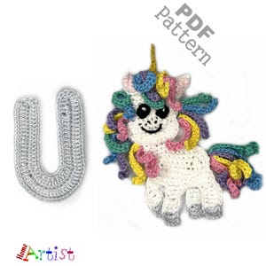 May include: A crocheted unicorn with a rainbow mane and tail, and a gray crocheted letter "U" are displayed on a white background. The unicorn has a smiling face and a golden horn. The text "PDF Pattern" is in the upper right corner.