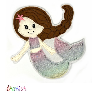 May include: A felt mermaid applique with a pink flower in her hair, a purple and pink bodice, and a glittery iridescent tail.