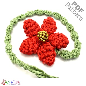 May include: A red crocheted flower with a gold bead center attached to a green crocheted cord. The cord is tied in a knot and has a long tassel. The image includes the text "PDF pattern".