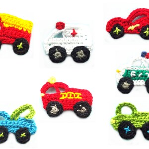 May include: Seven crocheted toy vehicles are displayed, including a fire engine, ambulance, race car, police car, tow truck, and two other cars. Each is made with colourful yarn and has black wheels.