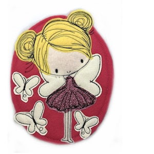 May include: A pink felt applique featuring a girl with blonde hair and wings, wearing a purple dress and surrounded by white butterflies.