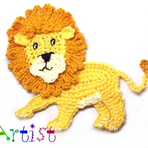May include: A crocheted lion applique with a yellow body, orange mane, and white facial features. The lion is standing on all fours with its tail curled up.