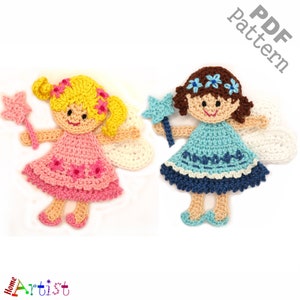 May include: Two crocheted fairy dolls with wings. One doll has blonde hair and a pink dress, the other has brown hair and a blue dress. Both dolls are holding a star-shaped wand.
