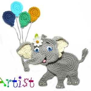 May include: A gray crocheted elephant holding four colorful balloons. The elephant has a white flower on its head and blue eyes. The balloons are blue, green, yellow, and navy blue.