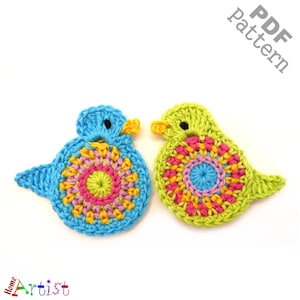 May include: Two crocheted bird ornaments, one blue and one green, with colorful circular designs in the center. The text "PDF pattern" is in the upper right corner of the image.