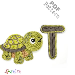 May include: A crocheted turtle and the letter "T" in shades of green, brown, and tan. The turtle has a detailed shell and a smiling face. The letter "T" is also crocheted. The words "PDF Pattern" are in the upper right corner.