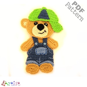 May include: Crochet pattern for a brown teddy bear wearing blue overalls and a green baseball cap. The pattern is available as a PDF download.