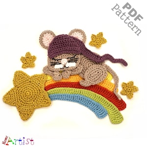 May include: A crocheted mouse wearing a purple hat sleeps on a rainbow with a yellow star. The crochet pattern is available as a PDF download.