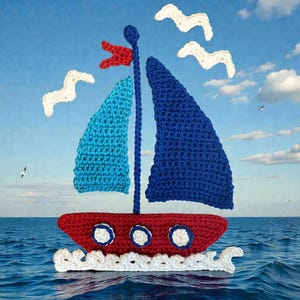 May include: A handmade crochet sailboat with blue and turquoise sails, a red hull, and a red flag. White crochet seagulls and waves are also present. The sailboat is set against a blue sky and ocean background.