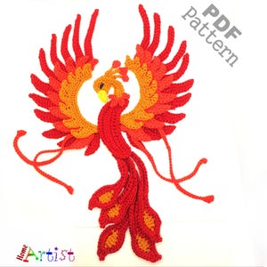 May include: A crocheted phoenix in red, orange, and yellow, with wings and tail feathers. The text "PDF Pattern" is visible in the upper right corner. The word "Artist" is visible in the lower left corner.