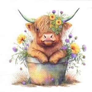 May include: A brown and white Highland cow with a flower crown sits in a green pot. The cow has a friendly expression and is surrounded by purple and yellow flowers.