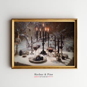 May include: A framed painting depicts a candlelit table set for a winter feast. A black candelabra with lit candles is the focal point, surrounded by wine glasses, decorative objects, and a plate of fruit. The painting is signed "Harbor & Pine STUDIO".