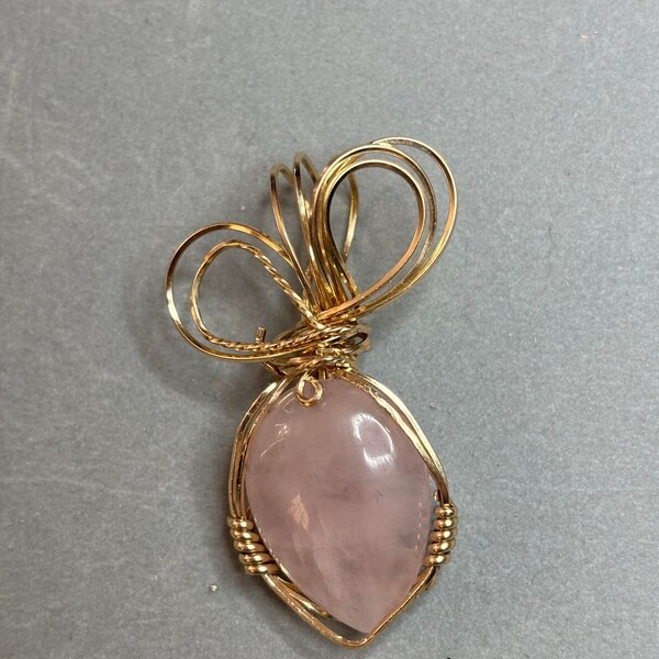 Gorgeous rose quartz wire wrapped in 14K gold filled wire. 1.92 inches x 1.19 inches. Great Mother’s Day or birthday gift.