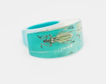 Chunky light blue lucite ring with real insect