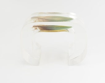 Large clear transparent lucite plastic and feather concept cuff bracelet