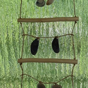 Wind chime made of willow branches and shells