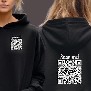 May include: Black hoodie with a white QR code and the text "Scan me!" on the front and back.