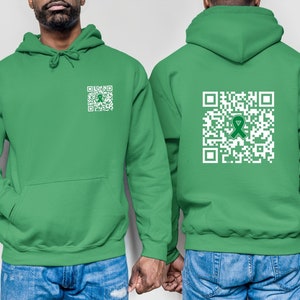 May include: Two green hooded sweatshirts with a white QR code printed on the front and back. The QR code on the back has a green ribbon in the center.