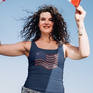 American flag in rhinestones on a navy tank top.