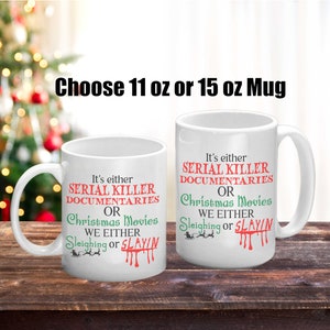 May include: Two white ceramic mugs with black text and red and green accents. The text on the mugs reads "It's either Serial Killer Documentaries or Christmas Movies. We either Sleighing or Slayin". The mugs are available in 11 oz or 15 oz sizes.