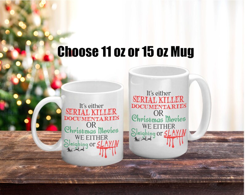 May include: Two white ceramic mugs with black text and red and green accents. The text on the mugs reads "It's either Serial Killer Documentaries or Christmas Movies. We either Sleighing or Slayin". The mugs are available in 11 oz or 15 oz sizes.