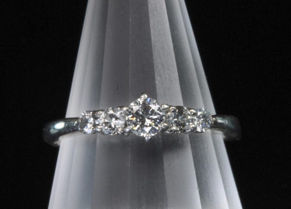 So feminine! Vintage platinum .50 ctw diamond engagement ring