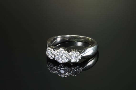 Sparkles galore! Vintage 14K white gold three diamond flower ring