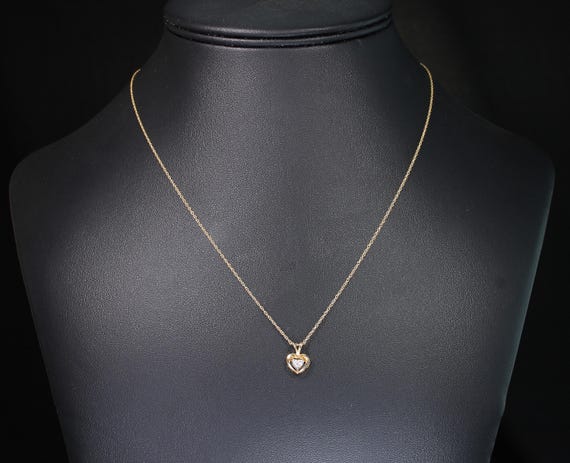 Vintage heart shaped 14K yellow gold pendant with .18 carat heart shaped diamond, 18" 14K yellow gold chain included