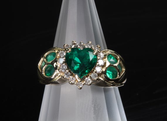 Vintage elegance & fun! 14K yellow gold ring, Chatham emeralds, heart shaped center; peek a boo sides, May birthstone jewelry. Size 7.5 only