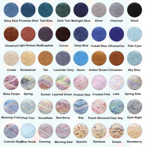 May include: A chart of 36 different colored yarn skeins, each with a unique name. The yarn colors include navy blue, teal blue, dark teal, midnight blue, silver, charcoal, black, chestnut, light roman red, graphite, cocoa, deep blue, cobalt blue, ultramarine, pale cyan, cream, buckwheat, tan, lavender grey, azure, amber brown, cinnamon, sky blue, bliss purple, spring, sunset, layered green, pinkish red, frosted pink, lake, spring rain, morning frost, pink fine, snowflake, red berry, bay, peach blossom, clear sky, dark night, colorful ray, blue snow, evening, morning dew, speckle, rainbow, dream, and strawberry.