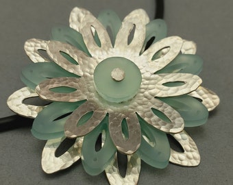 Sterling Silver Nine Petaled Flower Pendant with Cutouts and Aqua Center